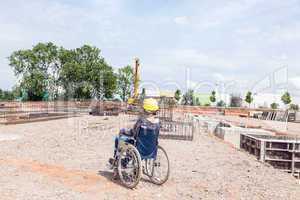 Engineer in a wheelchair on site
