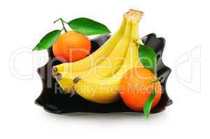 Tangerines and banana in a plate