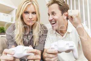 Couple Having Fun Playing Video Console Game