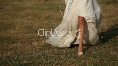Bride running across the field