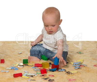 Young baby playing with educational toys