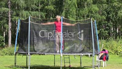 Woman jumping on a trampoline