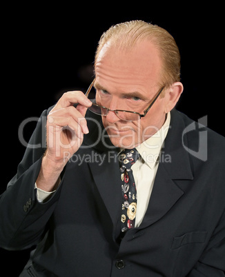Businessman Looking Over Glasses