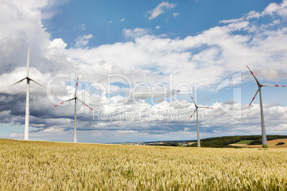 Wheatfield with windmills
