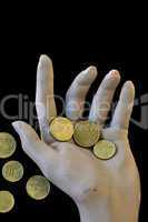 spare change worn hand holding money coins
