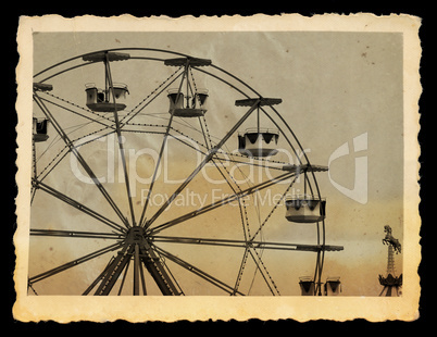vintage photo of ferris wheel in amusement park