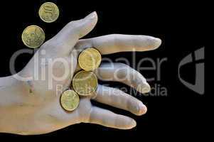 worn doll hand holding euro coins
