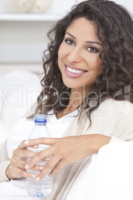 Happy Hispanic Woman Drinking Bottle of Water