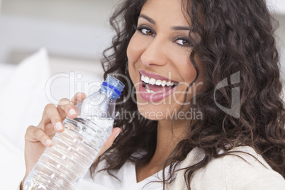 Happy Hispanic Woman Drinking Bottle of Water