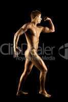 Nude man show athletic body with metal skin