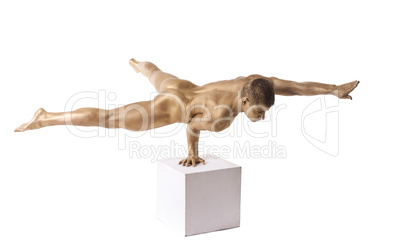 Strong man posing nude stand on hand isolated