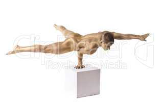Strong man posing nude stand on hand isolated