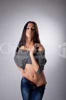 Beauty woman posing in jeans and tank top