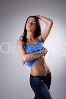 Young woman in jeans undress blue tank top