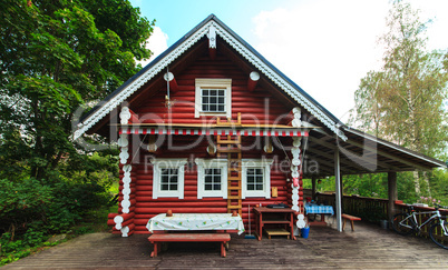 Red Log Cabin n the Forest