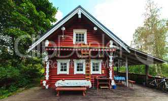 Red Log Cabin n the Forest