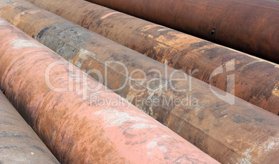 Group of old rusty metal pipes