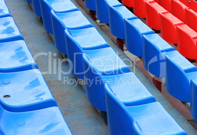 empty blue and red stadium seats