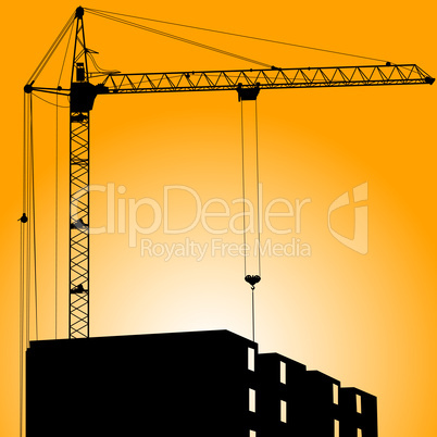 Silhouette of crane on a sunset on a building