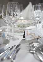 Fancy table set for a wedding party event dinnerand card on a ta