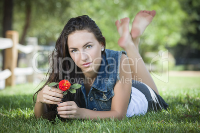 Attractive Mixed Race Girl Portrait Laying in Grass