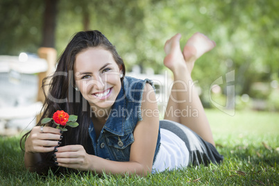 Attractive Mixed Race Girl Portrait Laying in Grass