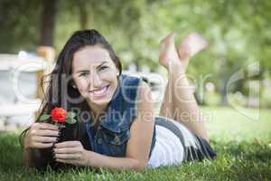 Attractive Mixed Race Girl Portrait Laying in Grass