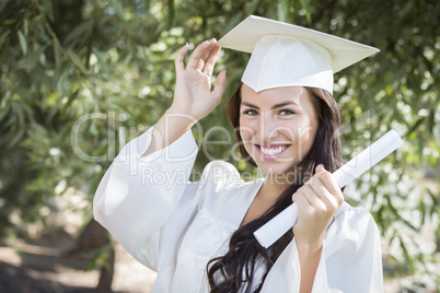 Graduating Mixed Race Girl In Cap and Gown with Diploma