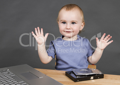 child with open hard drive