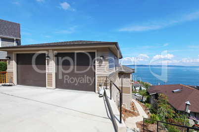 Two car garage on the hill with water view.