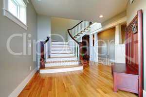 Luxury home beautiful hallway with large staircase and wood floor.