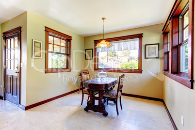 Nice dining room with wood walls and hardwood floor.