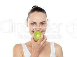 Attractive girl eating fresh juicy green apple