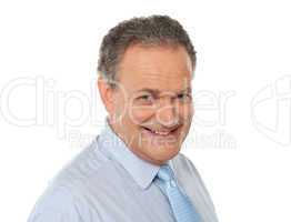 Closeup portrait of smiling senior male executive