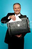 Businessman keeping documents safely
