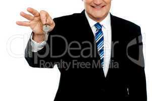 Cropped image of businessman holding keys