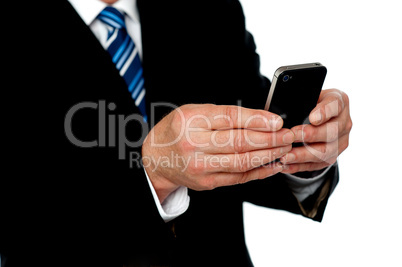 Cropped image of a man sending message