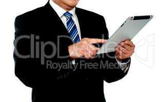 Businessman using tablet, cropped image
