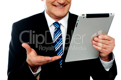 Cropped image of a businessman holding tablet pc