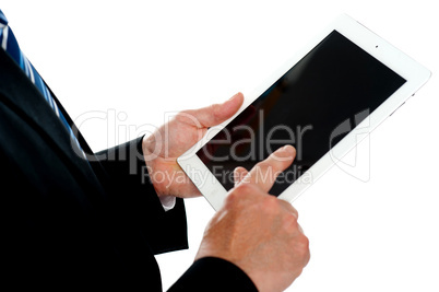 Man operating touch screen device, focus on tablet