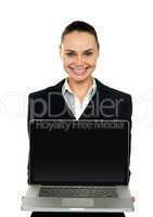 Female executive presenting brand new laptop