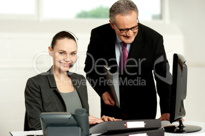 Team of two business executives working in office