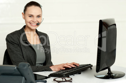 Female employee assisting customers