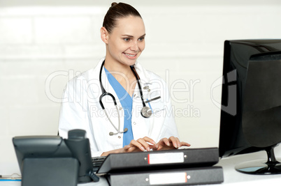 Medical professional working on computer