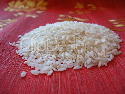 scattered rice on a red background