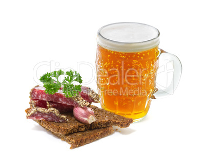mug of beer and salami with parsley on a white background