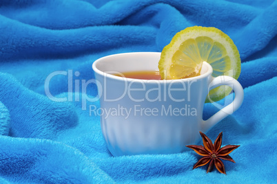 hot tea with lemon on a fur background