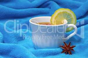 hot tea with lemon on a fur background