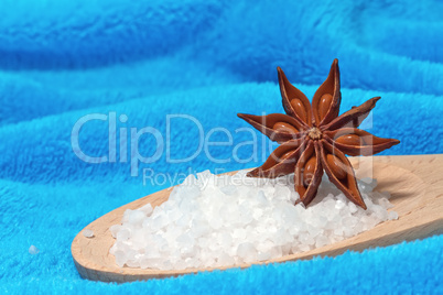 Sea salt bath with a star anise on a blue background