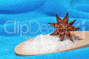 Sea salt bath with a star anise on a blue background